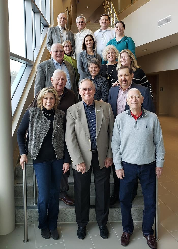 Former board members pose for a photo before the district's annual update 